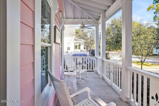 exterior space with ceiling fan, a healthy amount of sunlight, and lofted ceiling