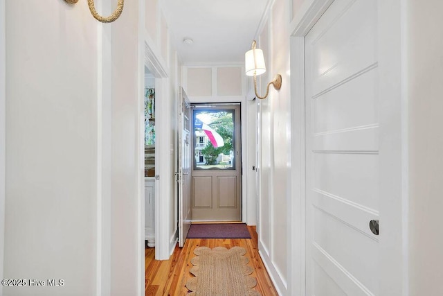 doorway to outside with light hardwood / wood-style flooring