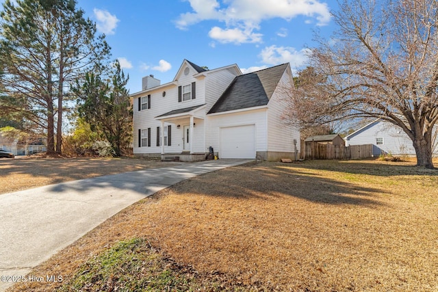 view of front property featuring a front yard and a garage