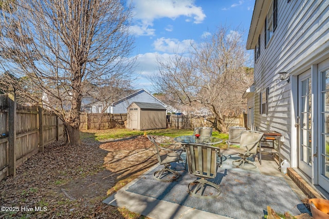 view of patio / terrace with a storage shed