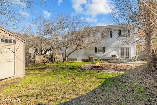 view of yard featuring a patio area and central AC