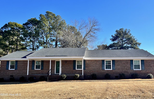 ranch-style house with a front lawn