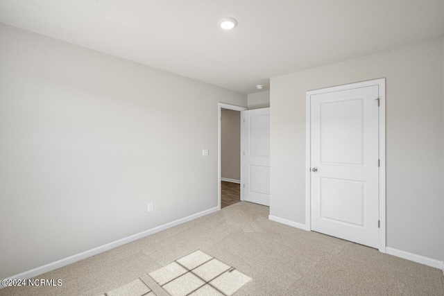 unfurnished bedroom featuring carpet flooring