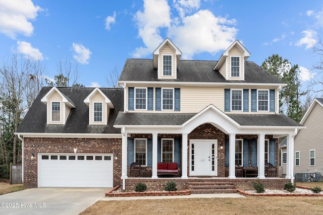 view of front of home with covered porch and a garage