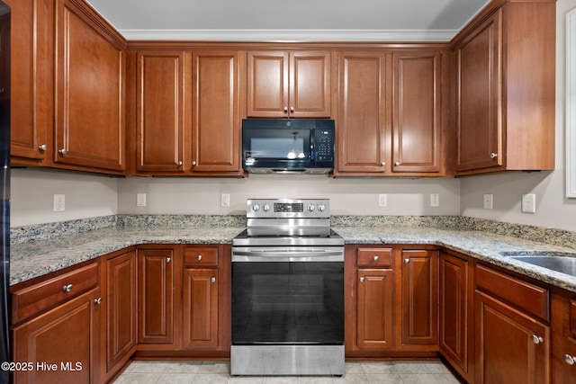 kitchen featuring light stone counters, sink, ornamental molding, and stainless steel electric range oven