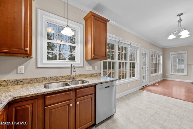 kitchen with sink, hanging light fixtures, crown molding, and stainless steel dishwasher