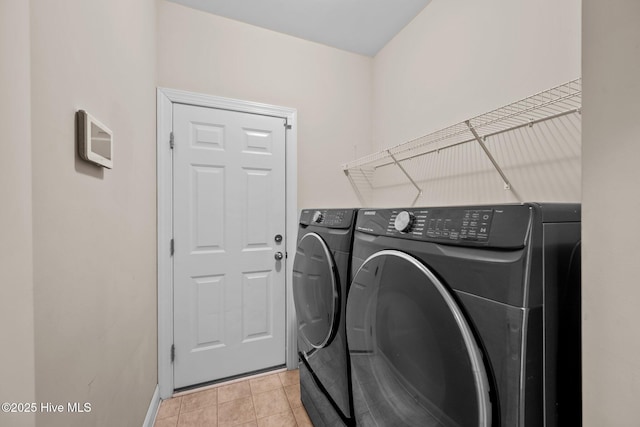 washroom with light tile patterned floors and independent washer and dryer