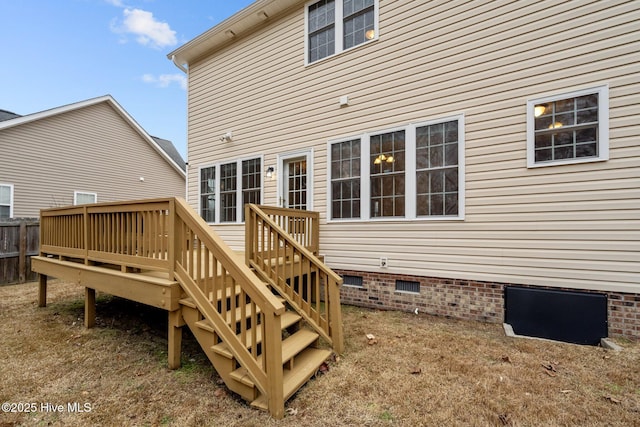 back of house with a wooden deck