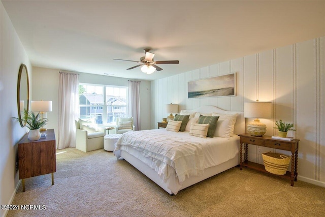 bedroom with ceiling fan and light colored carpet