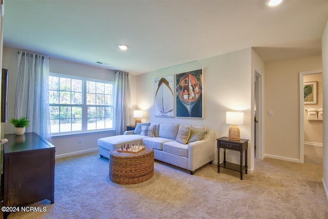 living room featuring light colored carpet