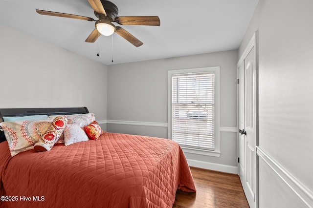 bedroom featuring dark hardwood / wood-style floors and ceiling fan