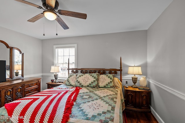 bedroom with ceiling fan and dark hardwood / wood-style flooring