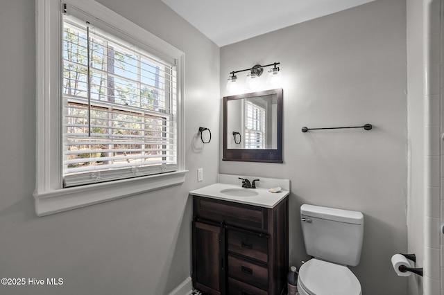 bathroom featuring toilet and vanity