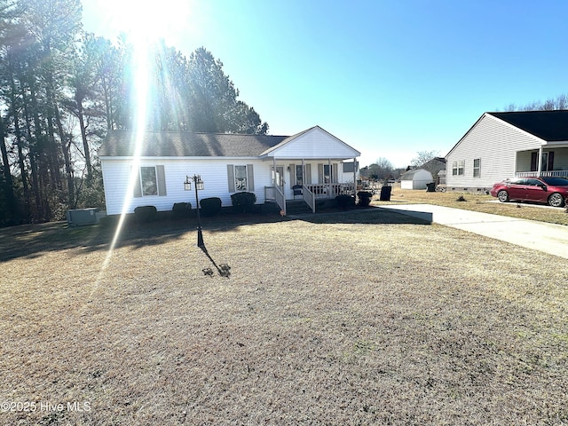 view of front of home with central AC unit and covered porch