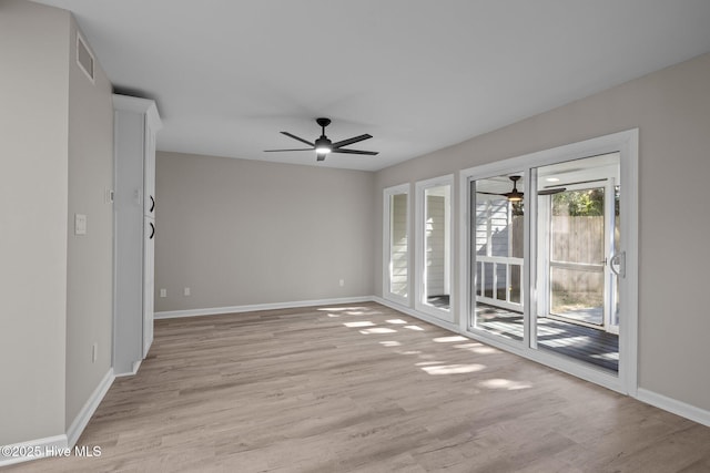 empty room with light hardwood / wood-style floors and ceiling fan