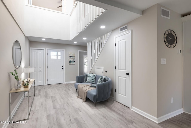 entryway with light hardwood / wood-style floors