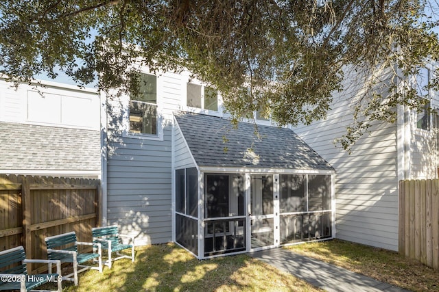 back of property featuring a sunroom