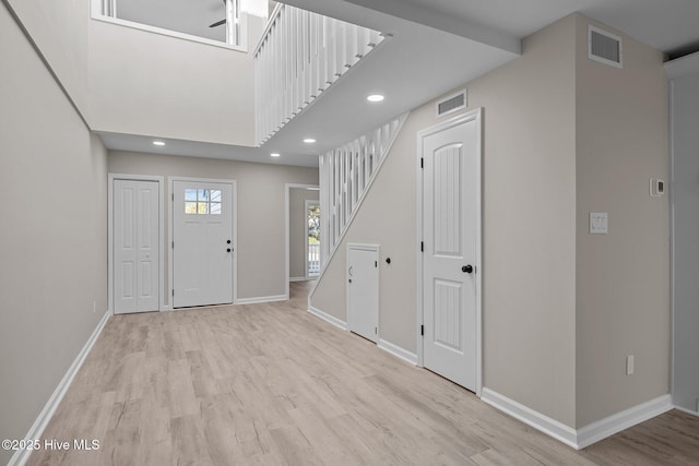 entrance foyer with light hardwood / wood-style floors