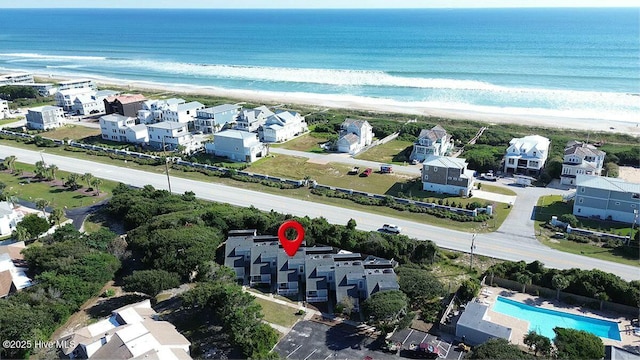 bird's eye view featuring a beach view and a water view