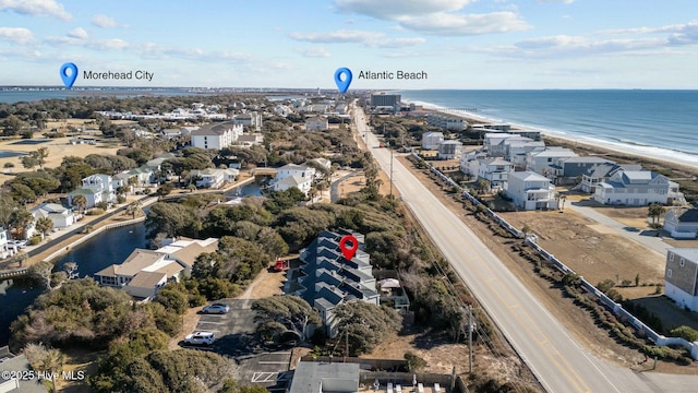 bird's eye view featuring a water view and a view of the beach