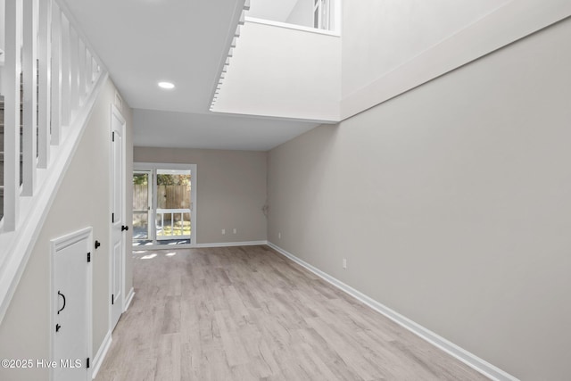 unfurnished living room with light hardwood / wood-style flooring