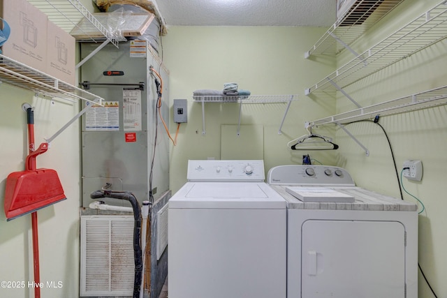 laundry room with washer and dryer