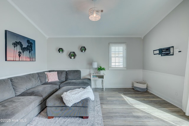 living room featuring hardwood / wood-style flooring and crown molding