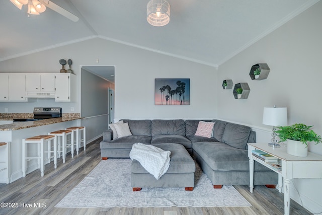 living room featuring crown molding, ceiling fan, vaulted ceiling, and light hardwood / wood-style flooring