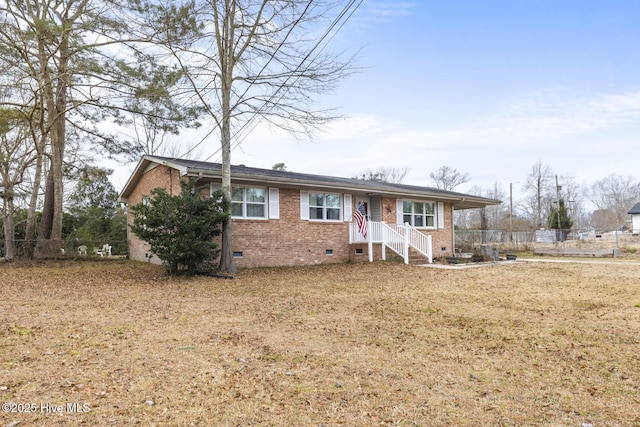 ranch-style house featuring a front yard