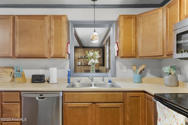 kitchen with sink, hanging light fixtures, and appliances with stainless steel finishes