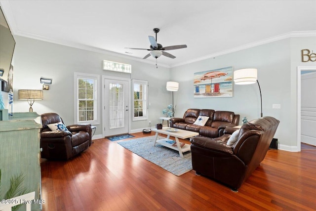 living room featuring ornamental molding, dark wood finished floors, and baseboards