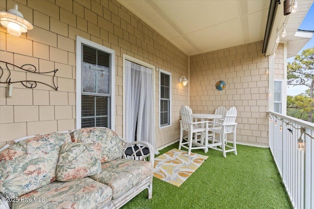 balcony featuring a sunroom