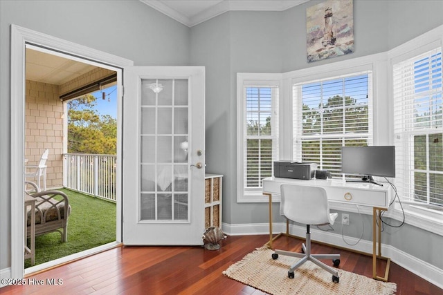 office with ornamental molding, dark wood-type flooring, a wealth of natural light, and baseboards