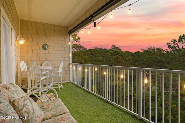 view of balcony at dusk