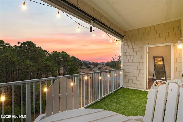 view of balcony at dusk