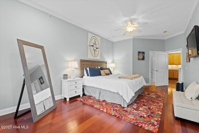 bedroom featuring dark wood-type flooring, crown molding, baseboards, and ceiling fan