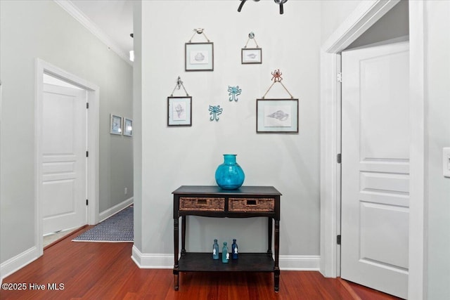 interior space with baseboards and wood finished floors