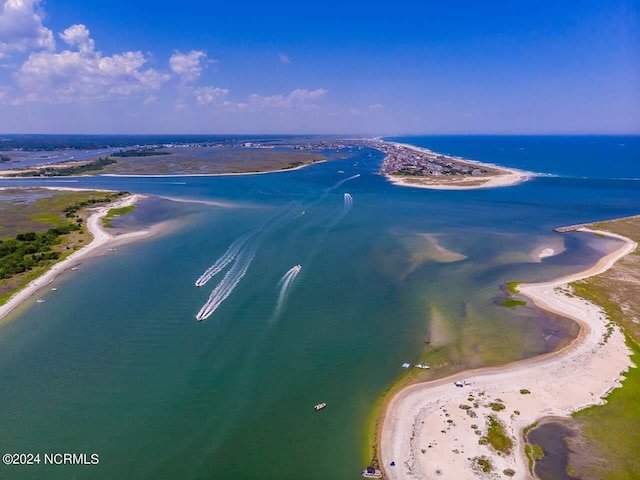 bird's eye view with a water view and a view of the beach