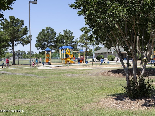 view of jungle gym with a lawn