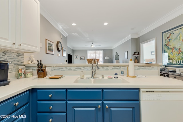 kitchen featuring white cabinets, dishwasher, sink, blue cabinetry, and crown molding