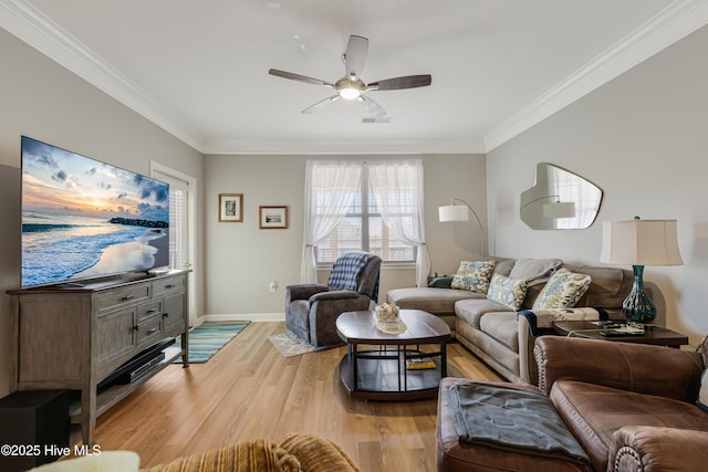 living room with ceiling fan, crown molding, and light hardwood / wood-style flooring