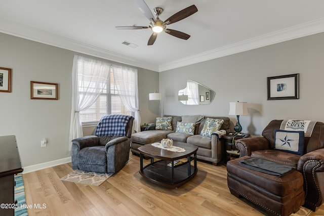 living room with ceiling fan, crown molding, and light hardwood / wood-style flooring