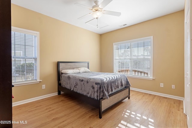 bedroom featuring ceiling fan and light hardwood / wood-style flooring