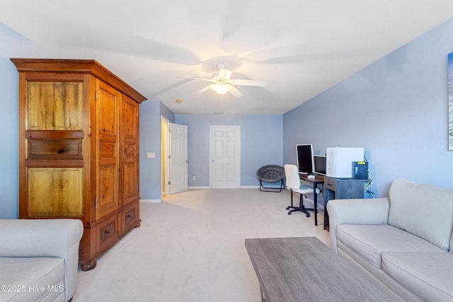 office space with light carpet and ceiling fan