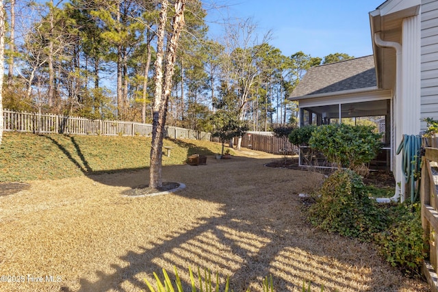 view of yard with a sunroom