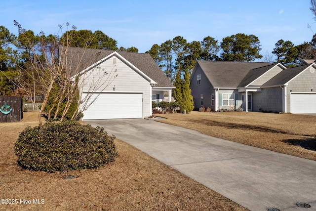 view of front of home featuring a garage and a front yard