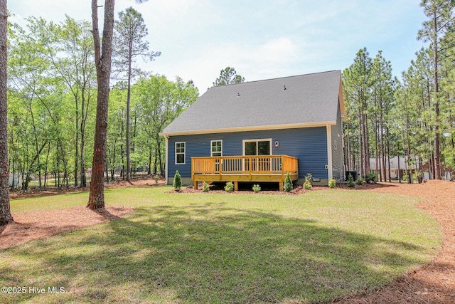 back of house featuring a wooden deck, a yard, and central AC unit
