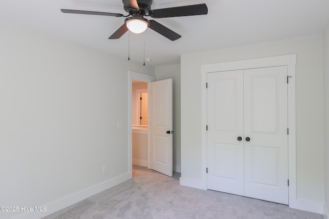 bathroom featuring baseboards, vanity, wood finished floors, and a marble finish shower