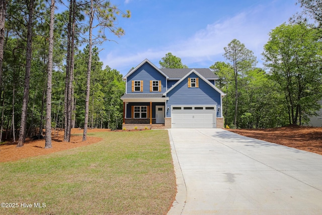 craftsman-style home with a garage, driveway, a porch, a front yard, and brick siding