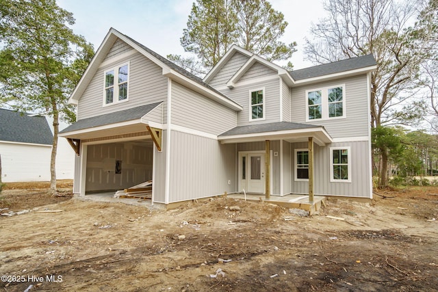 view of front of house with a garage and covered porch